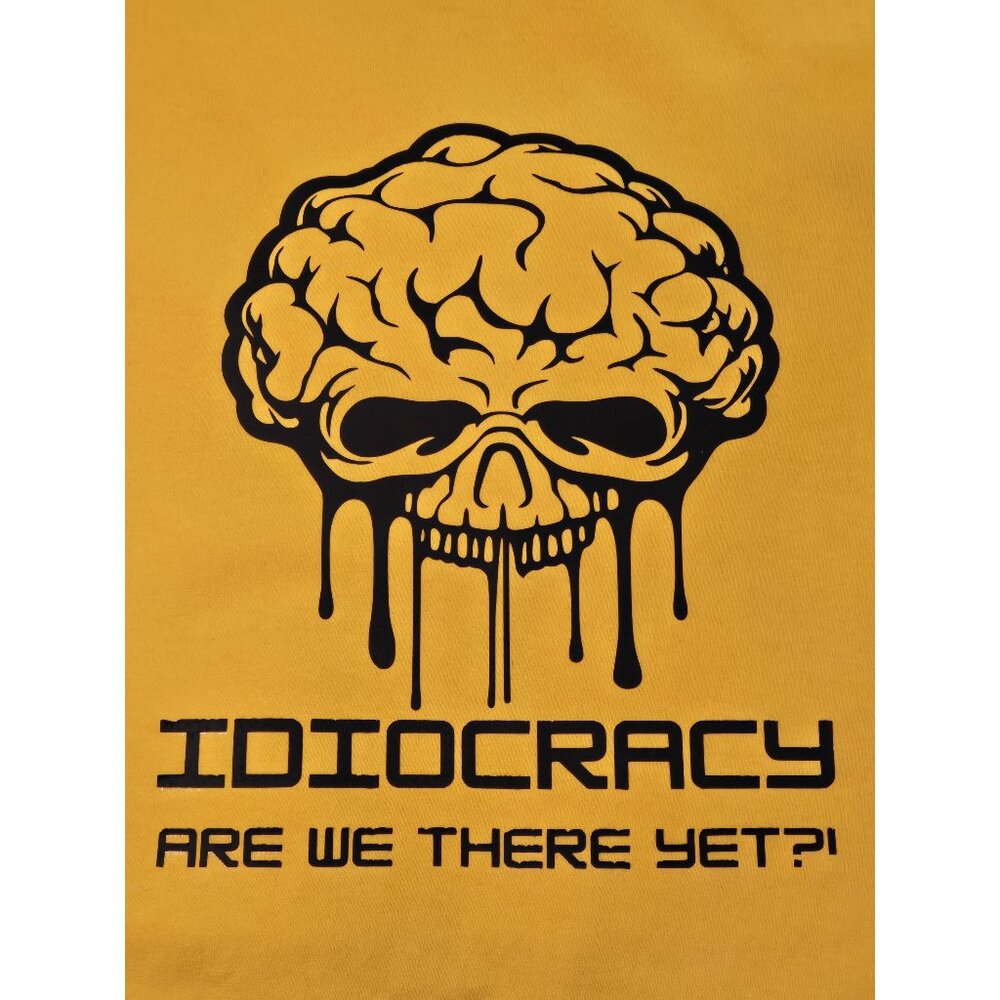 IDIOCRACY, are we there yet?! Bright yellow T-shirt. We're quickly getting there